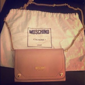 Worn Christian Louboutin pump & Moschino wallet